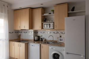Kuchyň nebo kuchyňský kout v ubytování Apartamento céntrico y acogedor + 20 fotografií