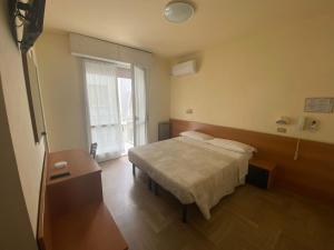 Postel nebo postele na pokoji v ubytování Hotel Soave