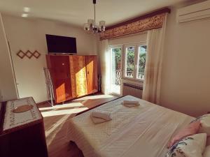 Postel nebo postele na pokoji v ubytování Apartment Grzin