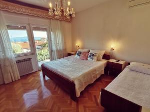 Postel nebo postele na pokoji v ubytování Apartment Grzin