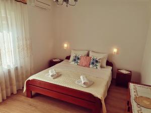 Postel nebo postele na pokoji v ubytování Apartment Grzin