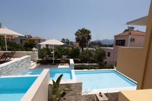 The swimming pool at or close to Dimani Suites