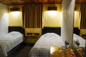 Un ou plusieurs lits dans un hébergement de l'établissement Hotel Central Teziutlan