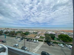 a view of a parking lot with cars on a highway at Hotel Soave in Cervia