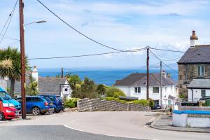 a street with cars parked in a residential neighbourhood at The Barn in St Ives
