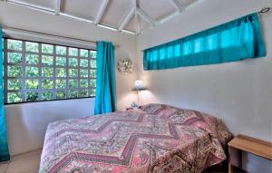 Postel nebo postele na pokoji v ubytování Casa Mariposa 2 BR in Playa Chiquita
