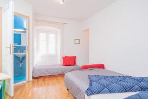 Postel nebo postele na pokoji v ubytování Harbourside Guesthouse Mandina - ZF Hvar