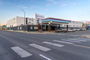 an empty street in front of a gas station at Sternwheeler Hotel & Conference Centre, Trademark by Wyndham in Whitehorse