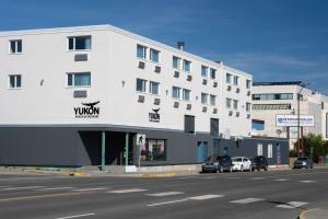 a white building with a virgin hotel on the side of a street at Sternwheeler Hotel & Conference Centre, Trademark by Wyndham in Whitehorse