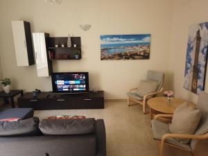 A television and/or entertainment centre at Assarotti Centre Apartment