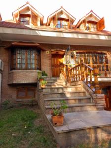 a brick house with stairs in front of it at Casa Bravo in Mendoza