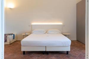 Postel nebo postele na pokoji v ubytování Ramo d'Aria Etna Boutique Hotel
