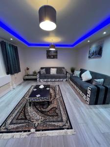 a living room with a couch and a rug at Ds Apartments in Blackpool