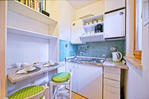 Kuchyňa alebo kuchynka v ubytovaní Art Apartments Postira
