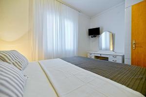 Posteľ alebo postele v izbe v ubytovaní Art Apartments Postira