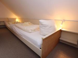 a bed in a room with lights on it at Ferienwohnung in Westerland auf Sylt in Westerland (Sylt) +25 photos