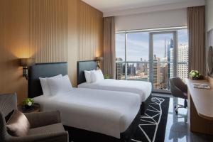 The First Collection Dubai Business Bay客房内的一张或多张床位