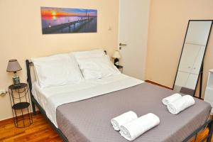 Posteľ alebo postele v izbe v ubytovaní Koukaki sunshine roof apartment