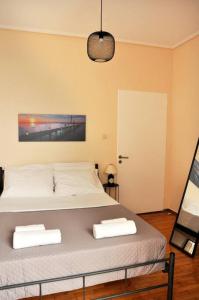 Posteľ alebo postele v izbe v ubytovaní Koukaki sunshine roof apartment