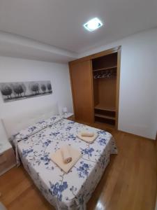 Postel nebo postele na pokoji v ubytování PISO NUEVO EN MOAÑA
