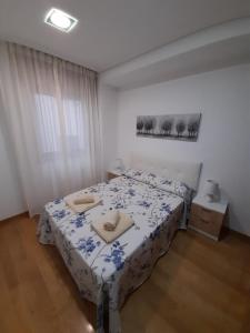 Postel nebo postele na pokoji v ubytování PISO NUEVO EN MOAÑA