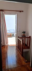 a room with an open door to a patio at Cycladic Maisonette (Dryopida, Kythnos) in Kithnos