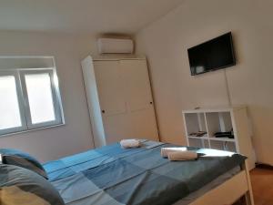 Posteľ alebo postele v izbe v ubytovaní Studio Punta Pakoštane