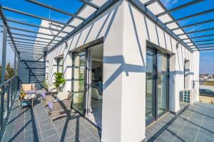 Balkón alebo terasa v ubytovaní Grey Lights Garden Apartment
