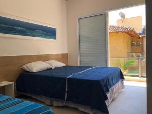 En eller flere senge i et værelse på CASA na Praia PERFEITA DE JUQUEHY + 33 billeder