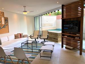 Et tv og/eller underholdning på CASA na Praia PERFEITA DE JUQUEHY