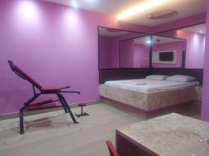 En eller flere senge i et værelse på Vélox Motéis