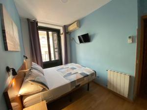 Ένα ή περισσότερα κρεβάτια σε δωμάτιο στο CH Casillas