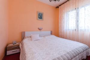 Posteľ alebo postele v izbe v ubytovaní Apartments Tugomila