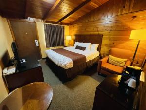 Postel nebo postele na pokoji v ubytování Apple Inn Motel