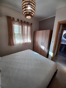 Łóżko lub łóżka w pokoju w obiekcie Elena apartment chalkidiki