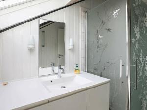 a bathroom with a white sink and a mirror at Seaside Spa Retreat - By Traum Ferienwohnungen in Hals