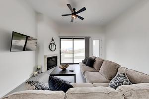 a living room with a couch and a ceiling fan at Barefoot Wishes in Oceano