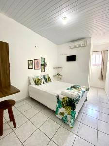 Ένα ή περισσότερα κρεβάτια σε δωμάτιο στο Pousada Rio Alegre