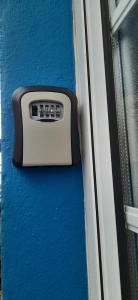 a close up of a button on the side of a window at Moradia Machado in Topo