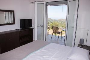 A bed or beds in a room at Villa Erofili Plakias south Rethimno Crete