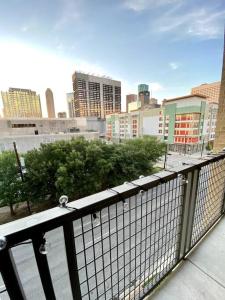 a view of a city from a balcony at Luxury Apartment with KING BED and POOL and FREE PARKING 4 in Houston