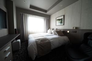 Letto o letti in una camera di Hotel Grand View Takasaki