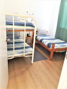 a couple of bunk beds in a room at Kangaroo Island - Island Beach Shack in Island Beach