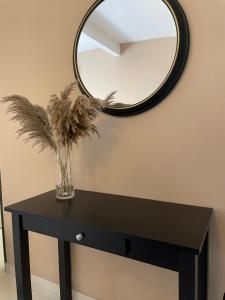 a black table with a mirror on the wall at MikasaCove @ Lost World of Tambun in Ipoh +2 photos
