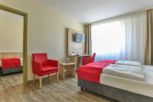 Rúm í herbergi á Rügen-Hotel