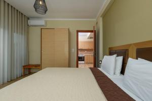 Posteľ alebo postele v izbe v ubytovaní Fani's Beach House