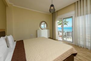 Posteľ alebo postele v izbe v ubytovaní Fani's Beach House