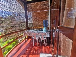a table on the deck of a house at Latitude 10 Siargao in General Luna