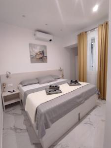 Posteľ alebo postele v izbe v ubytovaní Zoxi apartmani