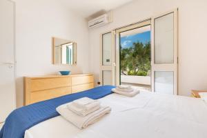 Postel nebo postele na pokoji v ubytování Hotel Residence Miramare